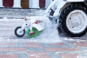 Machine remove snow from a city street