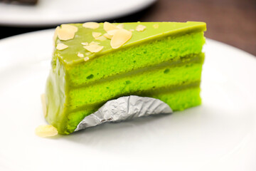 A slice of sponge cake on white dish