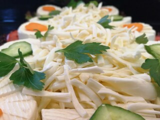 cheese plate served with various cheeses on the table