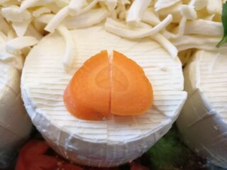 cheese plate served with various cheeses on the table