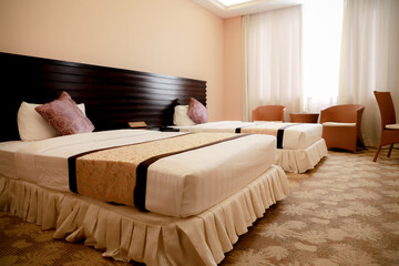 A hotel room, bedroom with two beds, curtain, lighting front view at the day in holiday