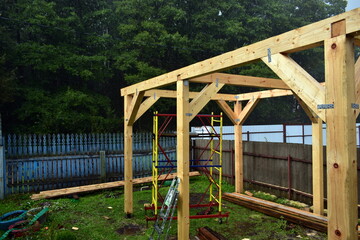 wooden pillars of a large gazebo under construction