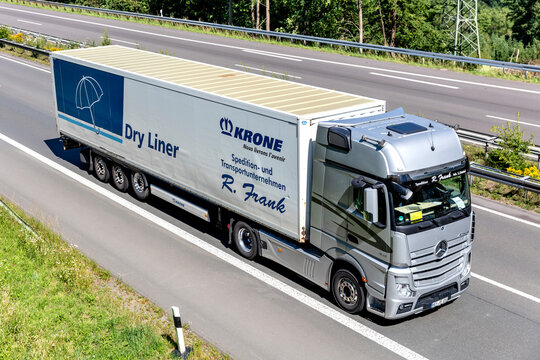 WIEHL, GERMANY - JUNE 26, 2020: R. Frank Mercedes-Benz Actros truck with box trailer on motorway.