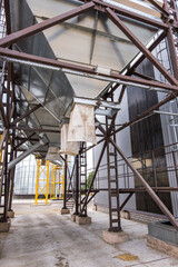 Modern Granary elevator. Silver silos on agro-processing and manufacturing plant for processing drying cleaning and storage of agricultural products, flour, cereals and grain.