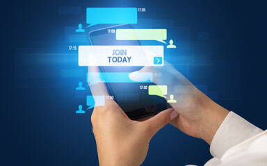 Female hand typing on smartphone with JOIN TODAY inscription, social networking concept