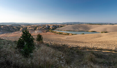 Fototapeta na wymiar Panoramic view from Crete Senesi, a scenic tuscan zone in the Tuscany countryside with beautiful hill and nature