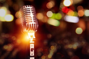 Retro style microphone on bokeh background