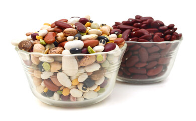 red beans and mixture of legumes in glass bowl on white