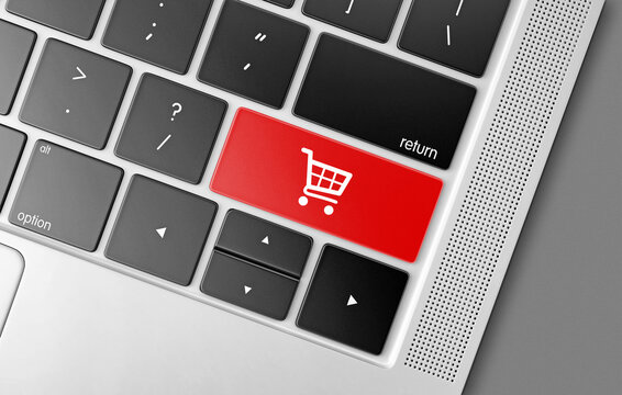 Red shopping cart key on a black computer keyboard, internet shopping concept picture