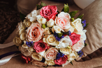 Wedding rings on the bride's bouquet. Beautiful bride's bouquet with roses.