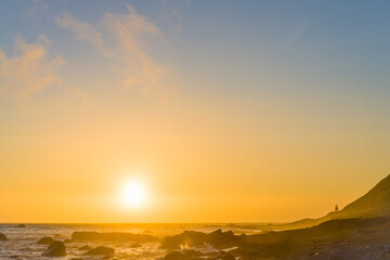 Sunset over the ocean, hill, lighthouse, sea, rocks