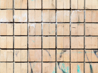 Old outdoor facing tiles for buildings. Abstract geometric architectural background.