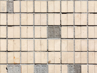 Old outdoor facing tiles for buildings. Abstract geometric architectural background.