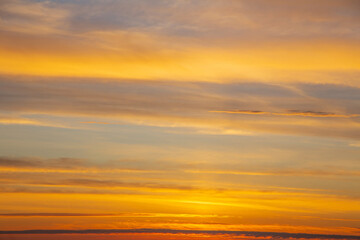 summer evening, sunset in yellow, orange and pink with clouds, background