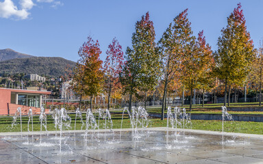 Foliage in Luino in a park with a little fountains