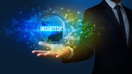 Elegant hand holding INSURTECH inscription, digital technology concept