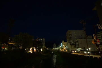 Obraz premium Night scene of small town with street lights in Japan, Matsumoto.