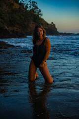 woman in a bikini posing on the beach