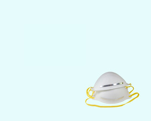 Face masks (N95) for preventing allergy, pollution, dust, mold, flu, cold, germ, bacteria and coronavirus (COVID-19) spread - close up, isolated objects on a blue template background, with copy space