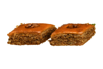 Baklava is a perfectly cut image on a white background of an Oriental dessert made of puff pastry with honey and nuts.