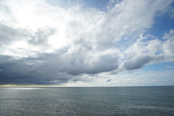 Obraz premium blue sea and cloudy sky over it. Blue Sea sky and Clouds