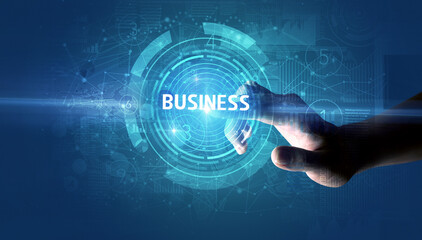Hand touching BUSINESS button, modern business technology concept