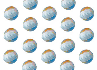 A surgical mask putting on a world globe protecting the world from pollution and infectious diseases (closeup, objects isolated on a white background template)