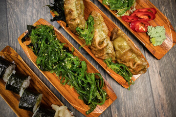 Japanese food of gyoza, seaweed spices and sushi 