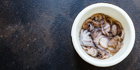 octopus baby raw fresh seafood on the table serving portion size top view place copy space for text diet pescetarian