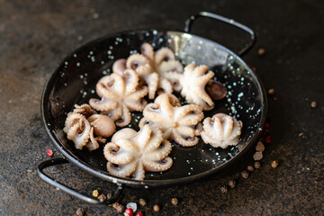 octopus baby raw fresh seafood on the table serving portion size top view place copy space for text diet pescetarian