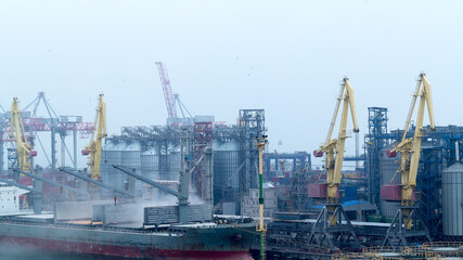 Fototapeta na wymiar Industrial container freight Trade Port scene in foggy cloudy day
