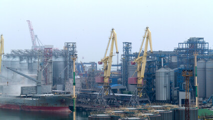 Fototapeta na wymiar Industrial container freight Trade Port scene in foggy cloudy day