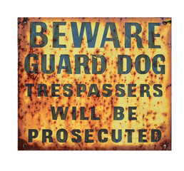 An old rusty Beware Guard Dog sign