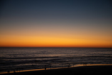 Obraz premium Coucher de Soleil sur la Plage de la Côte Sauvage.