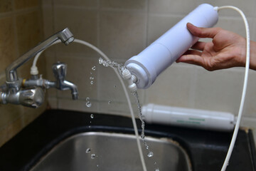 plumber installing new house water filter