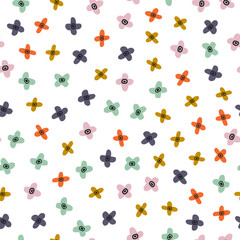 Abstract multi colored little flowers isolated on white background. Hand drawn vector seamless pattern. Wild flowers in cartoon style. Perfect for kid's printing, textile, wrapping paper, wallpaper.