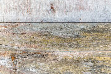 Wall of weathered wood boards with paint residues