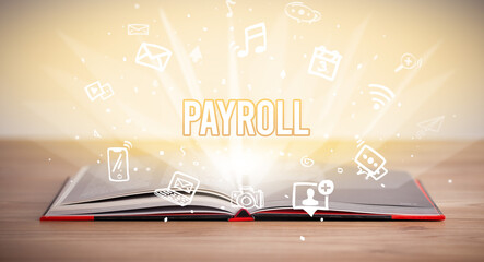 Opeen book with PAYROLL inscription, business concept