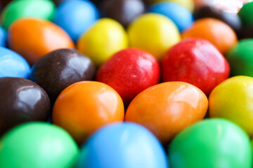 Fototapeta na wymiar colorful chocolate candies close up background