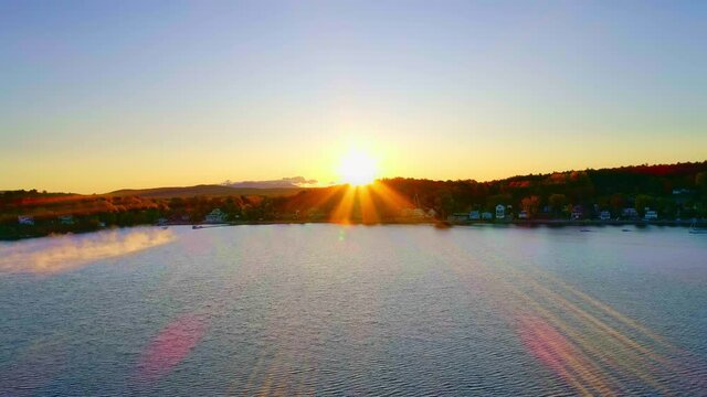 Vermont Flying Over Water into the Sun Rise