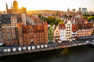 Gdansk, North Poland : Gdansk, North Poland - August 13, 2020: Wide angle panoramic aerial shot of Motlawa river embankment in Old Town during sunset in summer