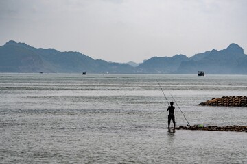 Naklejka premium fishing on the beach