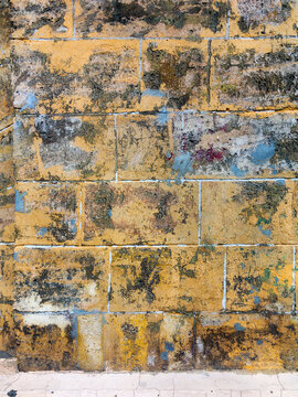 Wall of natural stone as textured background © Elena