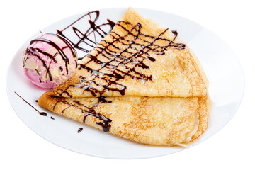 Thin dough pancake with specialty ice cream and chocolate topping. Served on a white plate.