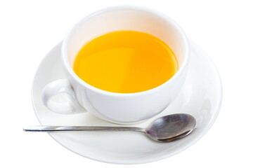 Bright colored fruit tea in a white cup. Isolated on white.