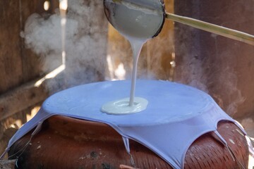 pouring rice oil into tissu