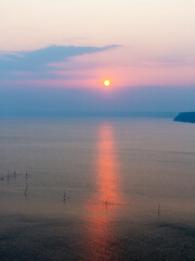 In fog disappears fantastic beautiful seascape overlooking fishing nets and horizon near coast of Kaliakra, Bulgaria. Minimalism. Image shows nice grain pattern at 100 percent