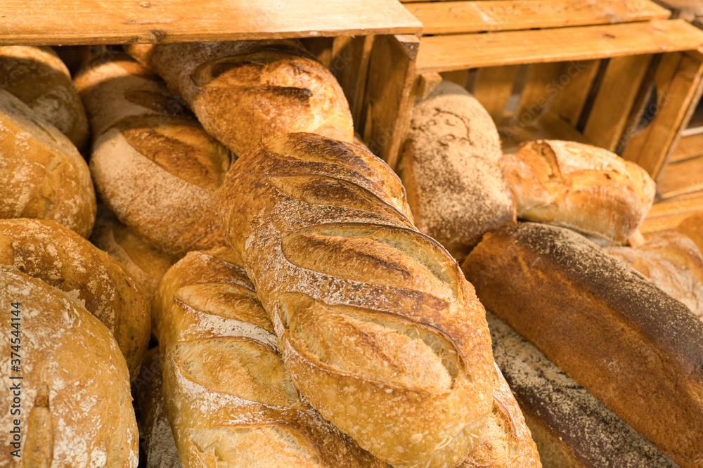 Wall mural freshly baked bread piled up