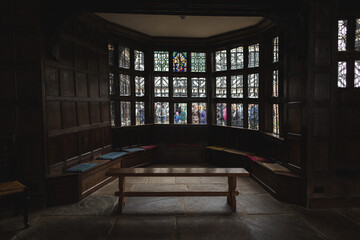 Tutor stained glass window in old building 