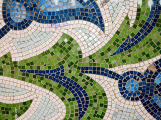 Detail of beautiful old collapsing abstract ceramic mosaic adorned building. Venetian mosaic as decorative background. Selective focus. Abstract Pattern. Abstract mosaic colored ceramic stones
